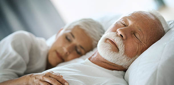 mature_couple_sleeping_soundly sleeping adult couple