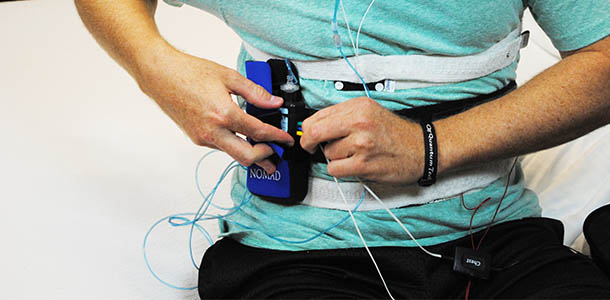 home sleep apnea test - man hooking up home sleep test