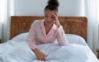 woman in bed can't sleep, stress anxiety, depression